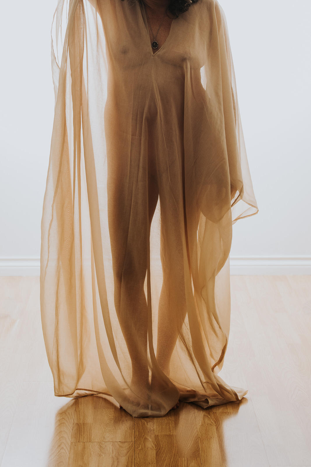 Anonymous portrait of a nude woman wearing beige tool. boudoir photography vancouver