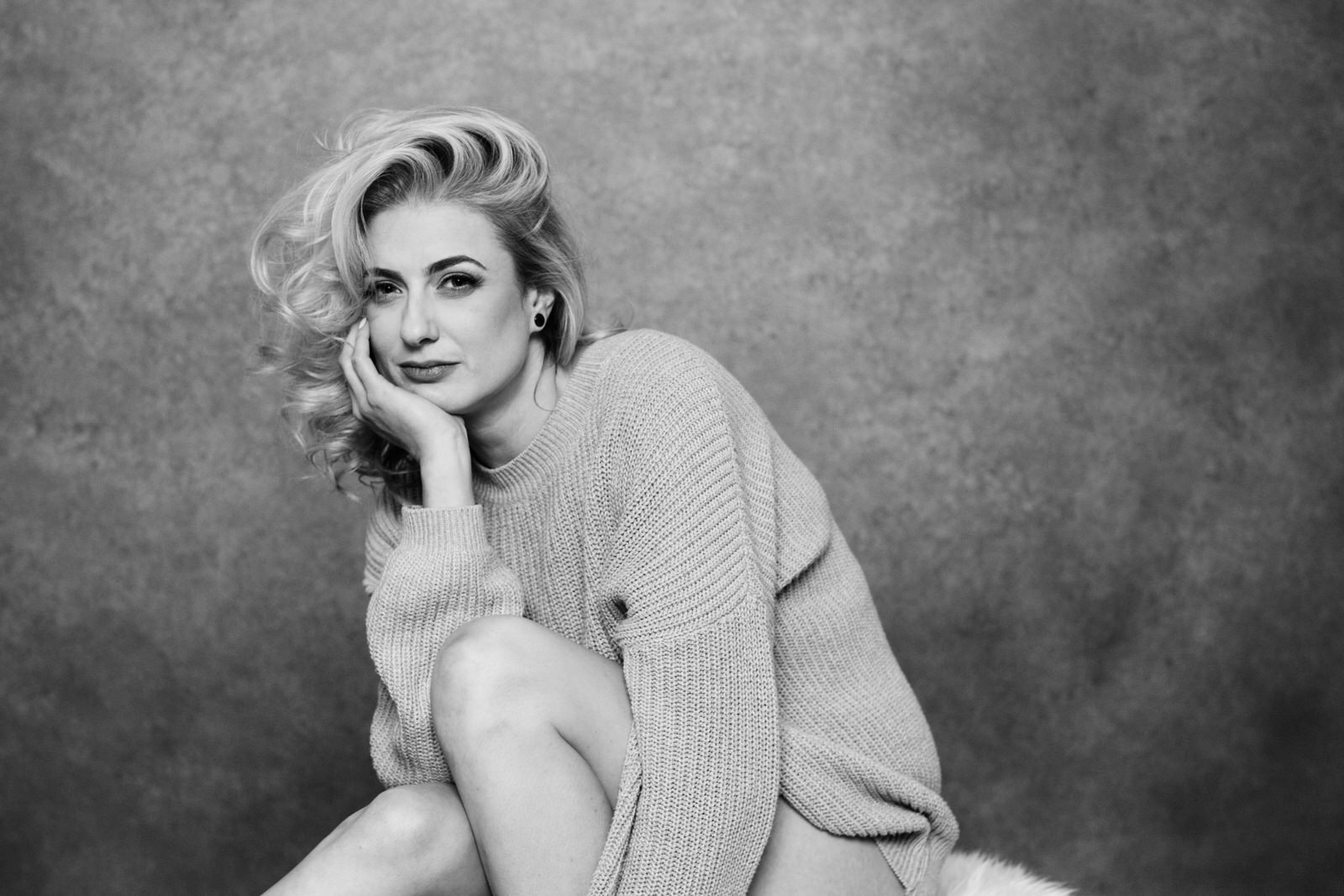 Vancouver Boudoir photoshoot with Black and white artistic timeless portraits of blonde woman with an edgy vibe with a cozy sweater