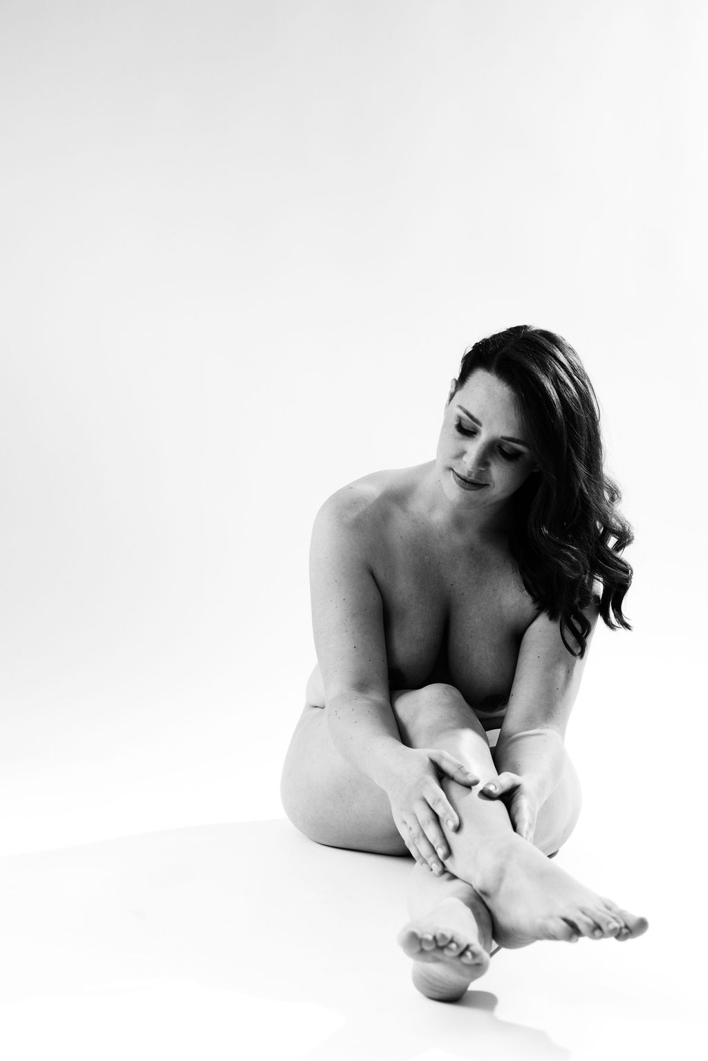 Vancouver Boudoir nude black and white portrait of a women sitting down