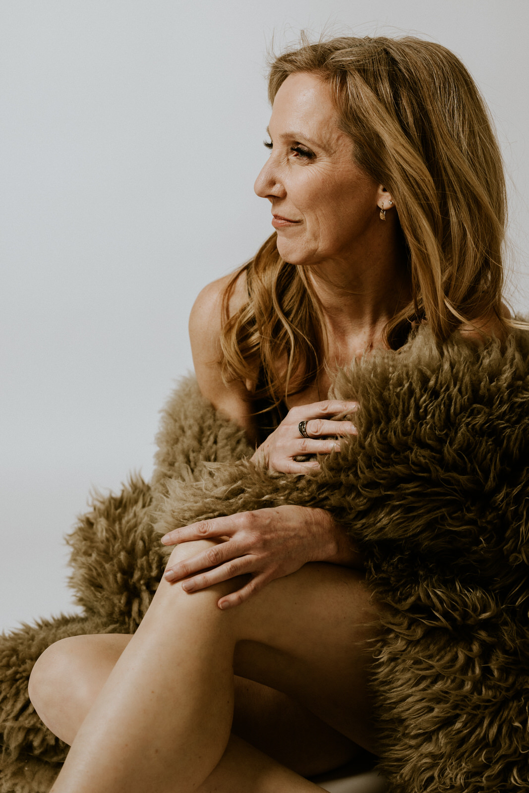 vancouver classy boudoir image of woman wrapped in fur