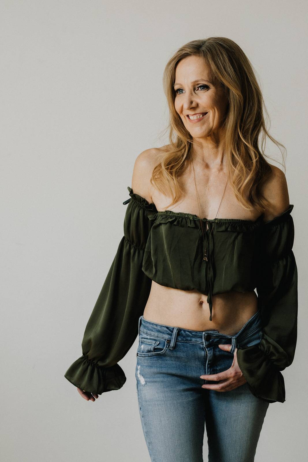 vancouver classy boudoir image of woman in jeans and revealing top