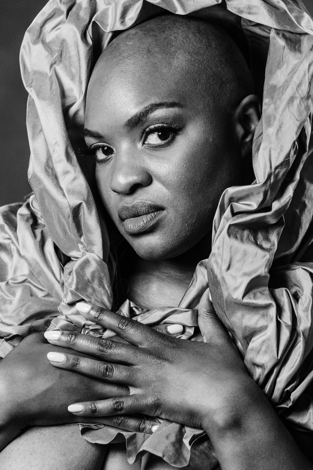vancouver boudoir photographer image of plus size black woman with alopecia draped in fabric around head