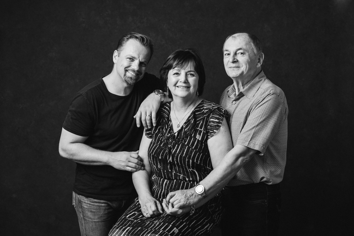 connection portraits image of a family of 3, parents and their adult son